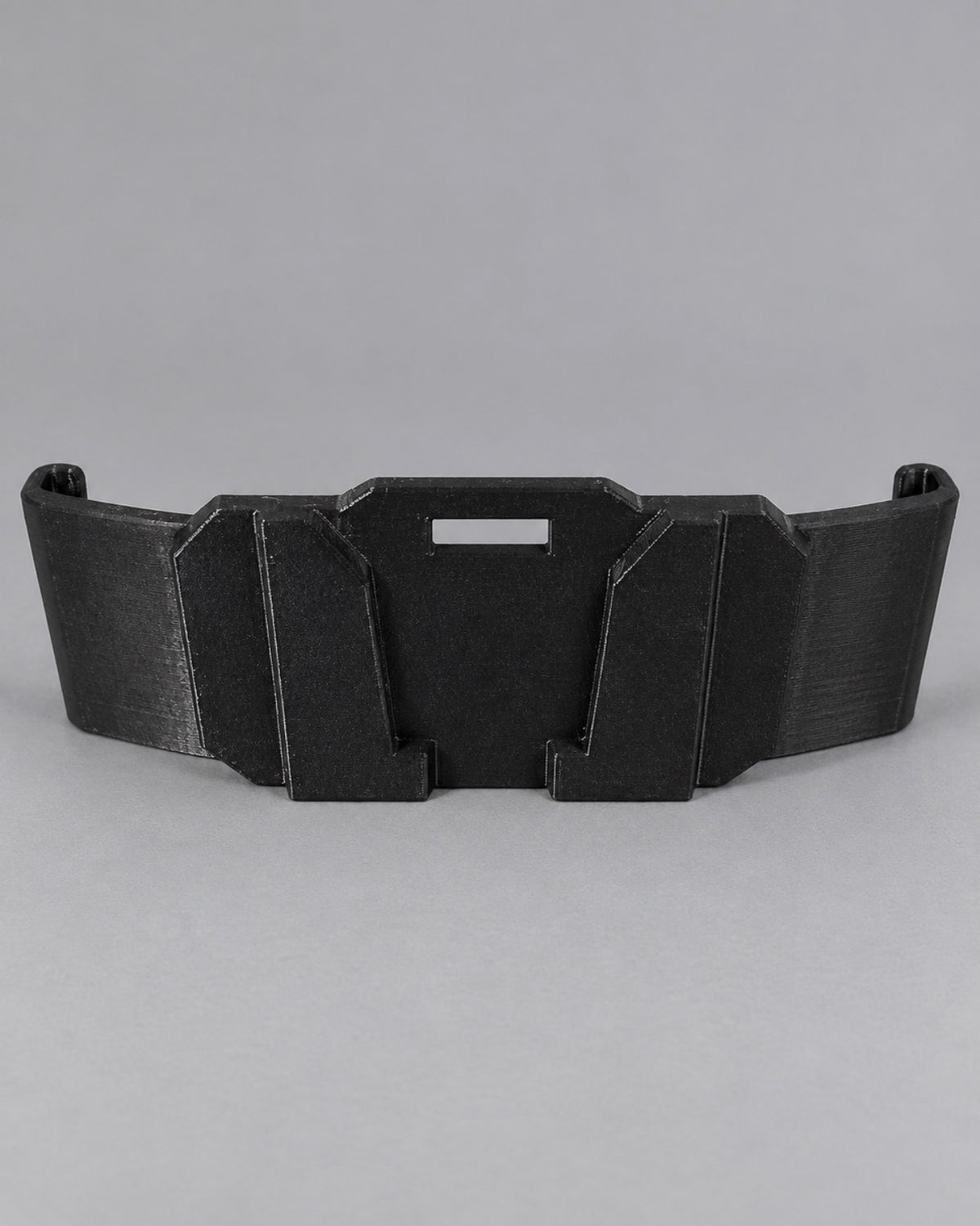 Black hard hat light mount attachment shown on a gray background